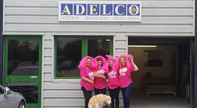 Adelco girls outside building with Cassie the dog - Pretty Mudder