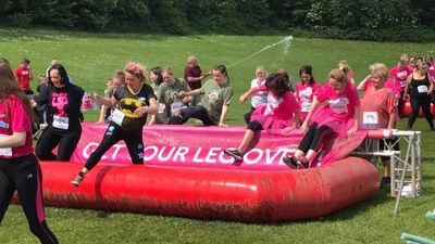Pretty Mudder action shot in water - Cancer research - Adelco ladies